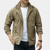 Men's olive green hooded cargo jacket with a lightweight design, featuring a zipper front, multiple pockets, and adjustable cuffs, shown in a khaki color variant, size 3XL, ideal for urban wind protection.