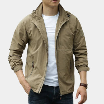Men's olive green hooded cargo jacket with a lightweight design, featuring a zipper front, multiple pockets, and adjustable cuffs, shown in a khaki color variant, size 3XL, ideal for urban wind protection.