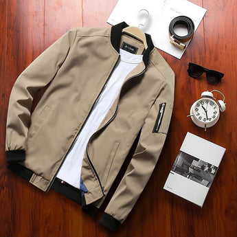 Men's olive green lightweight bomber jacket with zipper pocket, featuring long sleeves and a front zipper closure, displayed against a plain background.
