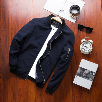 Men's olive green lightweight bomber jacket featuring a full-length zipper, ribbed collar and cuffs, and an additional zipper pocket on the sleeve.