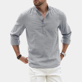 Men's olive green linen blend long sleeve shirt with a mandarin collar, displayed in a gray color in size 3XL. The shirt features relaxed shoulders and a sleek design, suitable for casual or formal occasions.