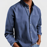 Men's olive green long-sleeve rugged outdoor shirt with a collared neck and button-up design.