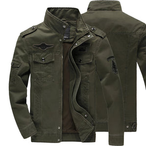 Men's olive green military-style canvas field jacket featuring a button-up front, multiple pockets, and a classic collar. The jacket has long sleeves and a rugged design, ideal for casual or outdoor wear.