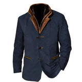 Men's olive green suede blazer with long sleeves, notched collar, and button closure, featuring a designer touch; styled with a dress shirt underneath and a visible pocket detail.