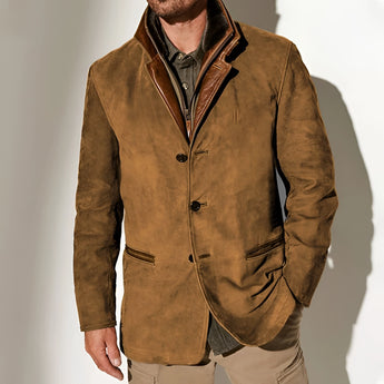 Men's olive green suede blazer displayed on a hanger, featuring a luxurious sport coat design with a brown exterior, detailed collar, buttoned sleeves, and paired with a beige dress shirt underneath.