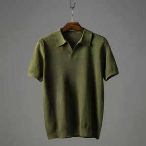 Men's olive green textured polo shirt featuring a classic collar, button-up front, and short sleeves, designed for lightweight breathability in a size 2XL.