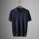 Men's olive green textured polo shirt featuring short sleeves, a classic collar, and a lightweight, breathable fabric.