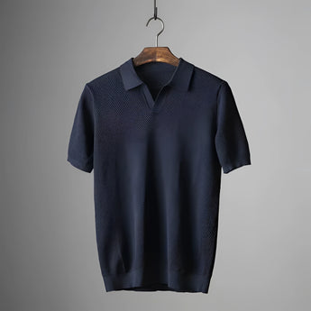 Men's olive green textured polo shirt featuring short sleeves, a classic collar, and a lightweight, breathable fabric.