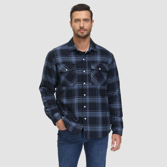 Men's long sleeve orange plaid flannel shirt featuring a tartan pattern, shown worn with visible arm and shoulder details.