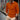 Men's orange long sleeve polo shirt in slim fit, displaying fall fashion style; shown in size 3XL, highlighting shoulder and neck details.