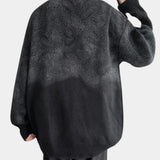 Men's oversized black chunky knit woolen crewneck sweater with long sleeves and a relaxed fit, showcasing the texture and design typical of cozy outerwear.