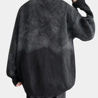 Men's oversized black chunky knit woolen crewneck sweater with long sleeves and a relaxed fit, showcasing the texture and design typical of cozy outerwear.