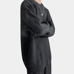 Men's oversized black chunky knit woolen crewneck sweater displaying long sleeves and a relaxed fit.