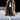 Men's oversized longline coat made from luxurious faux fur in a rich brown color, featuring a wide collar, long sleeves, and a knee-length design, perfect for urban winterwear.