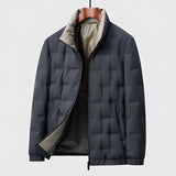 Men's blue quilted insulated winter jacket in size 4XL with long sleeves and a high collar.