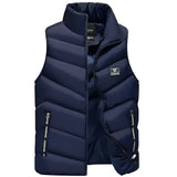 Men's marine blue insulated puffer vest, lightweight and water-resistant, with a high collar and button details, designed for outdoor activities like hiking.