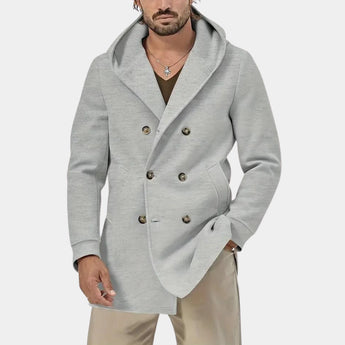 Men wearing a light grey oversized hoodie with a soft fabric, showcasing street style fashion, visible neck and sleeves, with a casual and relaxed fit.