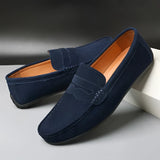 Men's red suede designer loafers featuring a luxurious design, with a synthetic rubber sole, highlighted in a vibrant electric blue tone, crafted from composite materials and leather for a stylish, comfortable fit.