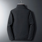 Men's reversible winter jacket with black and brown faux fur, featuring long sleeves, a collar, and buttons, designed for warmth and style with pockets for practicality.