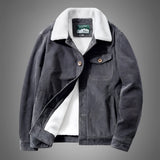 Men's gray sherpa-lined winter jacket with a rugged canvas exterior, featuring a collar and full sleeves, designed for insulation and warmth.