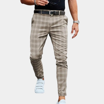 Men's slim fit beige plaid trousers in a casual and tapered style, shown with a persimmon color scheme in size 3XL. The focus is on the plaid pattern and tailored fit, paired with a white dress shirt and casual footwear.
