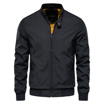 Men's slim fit black bomber jacket in lightweight urban style featuring long sleeves, a sleek collar, and button detailing.