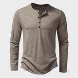 Men's slim fit black long sleeve Henley shirt made from a cotton blend material, featuring a button-up collar design.