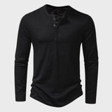 Men's slim fit black long sleeve Henley shirt made from a cotton blend, featuring a buttoned placket and a relaxed collar.