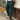 Men's slim fit black pleated trousers displayed on a flat surface, showcasing lightweight fabric and urban fashion style.
