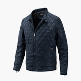 Men's slim fit quilted bomber jacket in a vibrant electric blue color, featuring a lightweight design suitable for winter fashion, with a collar and button detailing.