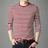 Men's slim fit black and white striped long sleeve crew neck tee shirt in a red color, size XL, paired with jeans.
