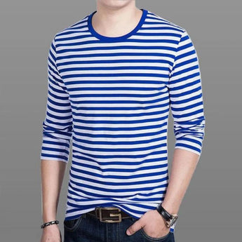 Men's slim fit long sleeve crew neck tee in blue with black and white stripes, shown on a person wearing jeans.