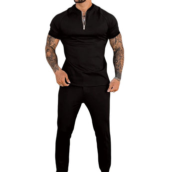 Men's slim-fit black zipper polo shirt featuring a stylish design with a collar and short sleeves, highlighting a tailored fit that accentuates the chest and waist, suitable for showcasing tattoos.