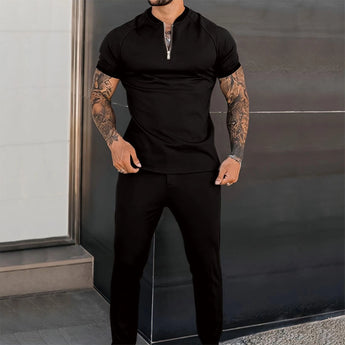 Men's slim fit black zipper polo shirt in 3XL, showcasing a stylish design. The shirt highlights the neck and shoulders with a fitted sleeve and waist, accommodating tattoos comfortably.
