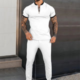 Men's slim fit black zipper polo shirt with short sleeves, shown on a model wearing size 3XL, highlighting the shirt's stylish design and tattoo-friendly fit, emphasizing the neck, shoulder, and sleeve areas.