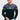 Men's black and white slim fit color block crew neck sweater, showing long sleeves and a casual design, modeled in a standing pose.