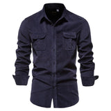 Men's slim fit dark blue denim shirt with long sleeves and a button-up front, featuring a classic collar. The casual top is designed for a stylish look in an electric blue color, suitable for various occasions.