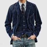 Men's slim fit dark gray corduroy blazer in vintage style, featuring long sleeves and a classic collar, paired with a dress shirt and tie.