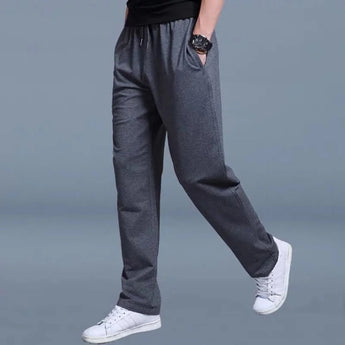 Men's dark gray slim-fit fleece joggers in size 3XL, featuring cuffed ankles and designed as part of a multipack collection.