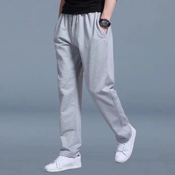 Men's slim-fit fleece joggers in light gray, featuring a cuffed ankle design, displayed in a multipack.
