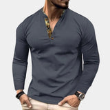 Men's gray slim fit Henley with long sleeves, waffle knit texture, and buttoned collar in a pullover style.