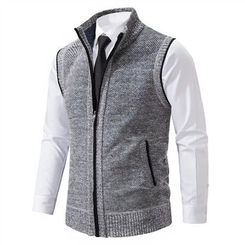 Men's slim fit light gray herringbone tweed vest made from a wool blend, featuring a button-down front and tailored design suitable for formal occasions.