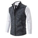 Men's dark gray wool blend slim fit herringbone tweed vest with buttons, shown with a dress shirt underneath, featuring a collar and formal style suitable for elegant occasions.