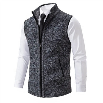 Men's dark gray wool blend slim fit herringbone tweed vest with buttons, shown with a dress shirt underneath, featuring a collar and formal style suitable for elegant occasions.