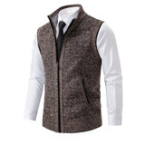 Men's slim fit herringbone tweed vest in brown wool blend, featuring a buttoned front and a tailored design, paired with a formal dress shirt.