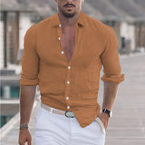 Men's slim fit gray linen shirt for summer fashion, featuring a breathable fabric, worn by a bearded model with rolled-up sleeves, showcasing the shoulder and neck details.