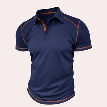 Men's slim-fit navy blue athletic polo shirt featuring contrast piping, short sleeves, and a collar suitable for sportswear.