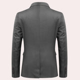 Men's slim fit navy blue blazer featuring long sleeves and a notched collar, designed for formal evening and party events.