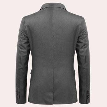 Men's slim fit navy blue blazer featuring long sleeves and a notched collar, designed for formal evening and party events.