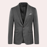 Men's slim fit navy blue blazer with a structured collar and long sleeves, designed for formal evening or party wear. The blazer is styled with a dress shirt and tie, adding a sophisticated touch to the outfit.